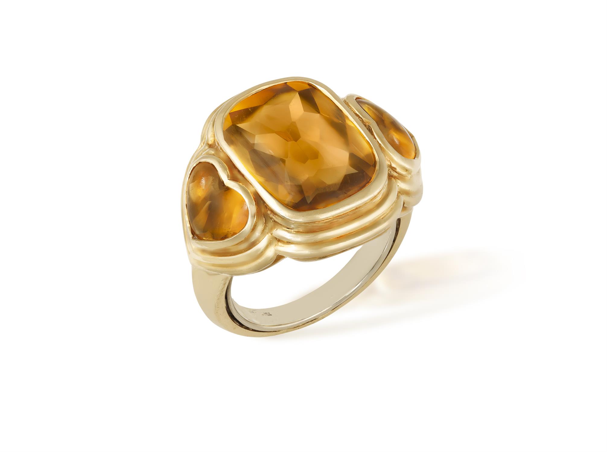 A CITRINE DRESS RING, BY REPOSSI The faceted top cabochon cushion-shaped citrine between two