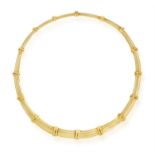 A GOLD NECKLACE, BY GUCCI Of polished links with reeded detailing, in 18K gold, signed Gucci,