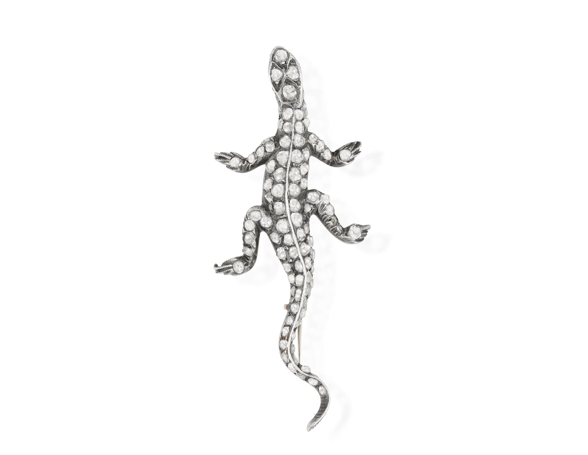 A LATE 19TH CENTURY DIAMOND AND RUBY NOVELTY BROOCH, CIRCA 1880 Modelled as a lizard,