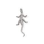A LATE 19TH CENTURY DIAMOND AND RUBY NOVELTY BROOCH, CIRCA 1880 Modelled as a lizard,