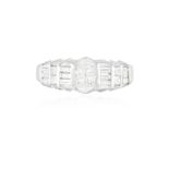 A DIAMOND DRESS RING The central princess-cut diamond within a surround of triangle,