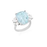 AN AQUAMARINE AND DIAMOND DRESS RING Composed of a central cushion-shaped aquamarine weighing