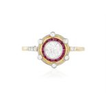 AN EARLY 20TH CENTURY DIAMOND AND RUBY TARGET RING, CIRCA 1920 The central old brilliant-cut