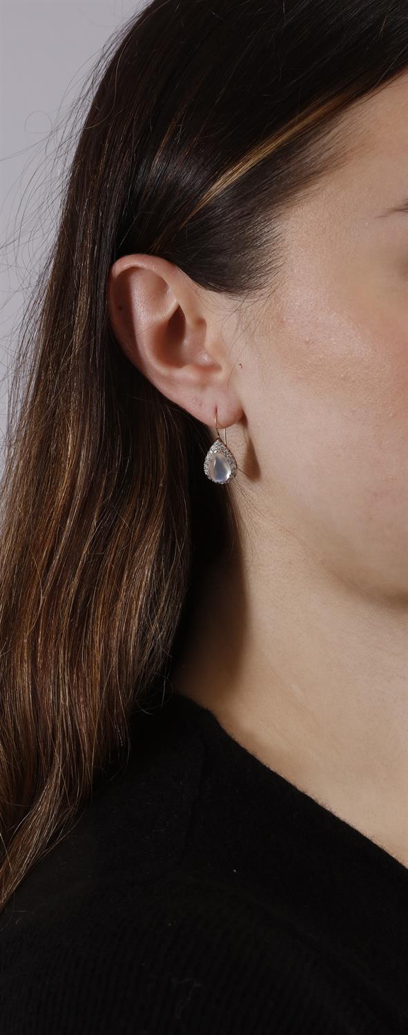 A PAIR OF MOONSTONE AND DIAMOND PENDENT EARRINGS Each composed of a pear-shaped cabochon - Image 2 of 3