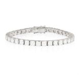 A DIAMOND LINE BRACELET Composed of a continuous line of brilliant-cut diamonds within