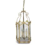 A FREHCH ROCOCO STYLE GILT BRASS FRAMED PENTAGONAL LANTERN The glazed panels within foliate