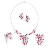 A RUBY AND DIAMOND SUITE, comprising a pendant/brooch, a second brooch, a pair of earrings and a