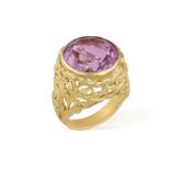 AN AMETHYST RING, set with a circular amethyst at the centre within collet-setting,