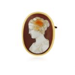 AN AGATE CAMEO BROOCH, oval, carved in high relief, depicting a Classical female bust in profile,