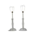 A PAIR OF CLEAR GLASS TABLE LAMPS, with bobbin stem design, 50cm high to socket