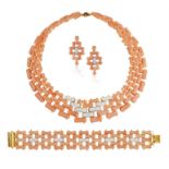 A CORAL AND DIAMOND SUITE, comprising a necklace, a bracelet and a pair of earclips,