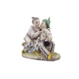 A MODERN CONTINENTAL PORCELAIN FIGURAL GROUP, of oriental couple drinking from a flask and seated