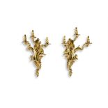 A PAIR OF FRENCH 18TH CENTURY STYLE ORMOLU THREE LIGHT WALL SCONCES With candleholders rising