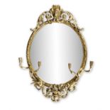 A LARGE 19TH CENTURY GILTWOOD GESSO GIRANDOLE MIRROR The oval glass plate enclosed within