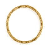 A GOLD NECKLACE, highly articulated, composed of interlocking textured gold links throughout,