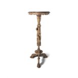 A FRENCH PROVINCIAL CARVED LIMEWOOD TORCHERE STAND, the circular top carved with foliate rim,