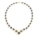 A SAPPHIRE AND DIAMOND PENDANT NECKLACE, composed of a row of graduated oval-shaped sapphire