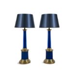 A PAIR OF BRASS MOUNTED BLUE GLASS COLUMNAR TABLE LAMPS 58cm high