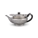 A VICTORIAN SILVER DEMI-FLUTED TEAPOT (c.25.8 troy ozs including ebon handle) 27cm wide over