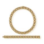AN 18K GOLD NECKLACE WITH BRACELET EN SUITE, ITALIAN, of articulated design, composed of geometric