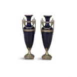 A PAIR OF PORCELAIN AND GILT METAL MOUNTED VASES of large proportions