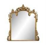 A LARGE VICTORIAN GILTWOOD AND GESSO OVERMANTLE MIRROR Of arched rectangular form,