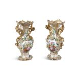 A PAIR OF CONTINENTAL GILT AND FLOWER ENCRUSTED PORCELAIN SPILL VASES, 19TH CENTURY With flared