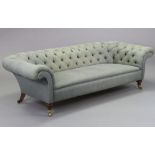 A LATE VICTORIAN CHESTERFIELD SOFA, upholstered buttoned pale grey material, on short turned front