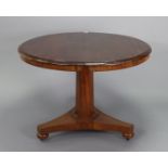 A 19th century mahogany ‘loo’ or centre table with a circular tilt-top, & on an octagonal tapered
