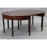 A Georgian mahogany D-end dining table with plain top & frieze, on fluted square legs, with
