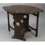 An oak drop-leaf occasional table with poker-work design to the shaped oval top, & on pierced &