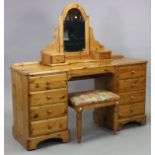 A pine knee-hole dressing table fitted four long drawers to either side, 58” long x 29½” high;