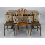 An oak refectory table with a rectangular top, & on shaped & pierced end supports joined by a