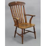 A lath-back elbow chair with a hard seat, & on turned legs with spindle stretchers.