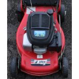 An Emak “Efco Serie LR” petrol-driven lawnmower with a grass-box.