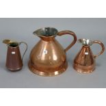 Two vintage copper measures, 11½” & 9½” high; & a copper ewer, 9¾” high.