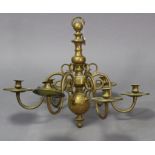A brass Dutch-style six-branch ceiling light fitting with scroll arms, 26” wide x 20½” high.