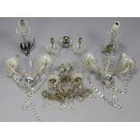 A pair of glass twin-branch wall lights hung with prism drops & strands-of-beads, 14¾” wide x 10½”