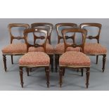 A set of six Victorian beech balloon-back dining chairs with padded seats, & on fluted & turned