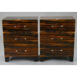 A PAIR OF R.V. ASTLEY ‘MAGLASSA’ MACASSAR EBONY VENEERED THREE-DRAWER BEDSIDE CHESTS with glass