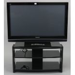 A Panasonic “Viera” 42 HDMI television with a remote control, & stand.