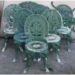 A green painted cast-metal patio set comprising a circular table, 34” diam. & a set of six chairs.