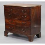 An 18th century mahogany chest with moulded edge to the rectangular top, fitted with a brushing