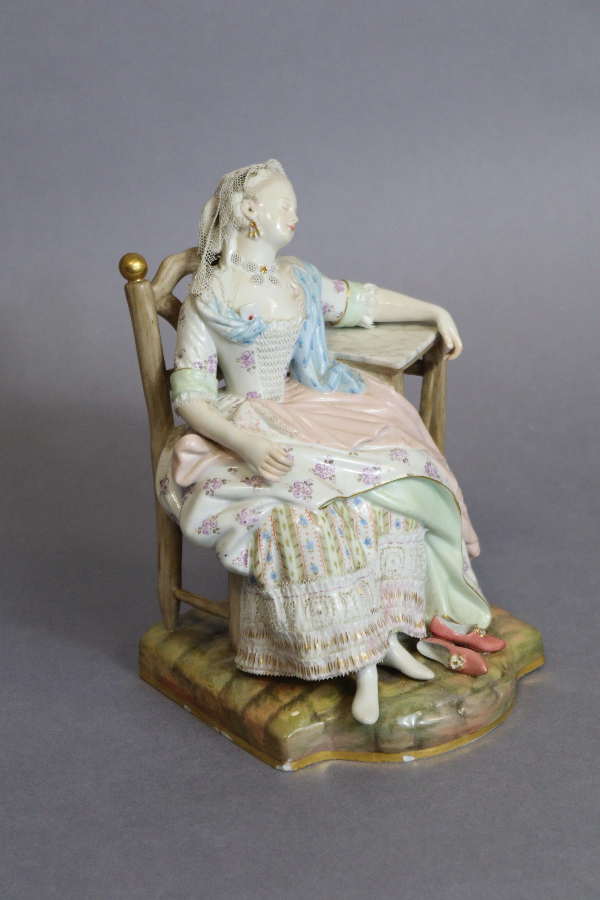 A Meissen figure of a lady asleep in a chair, one arm resting on a marble-top table, blue crossed - Image 2 of 5