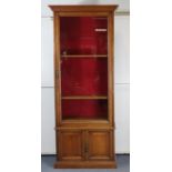 A late 19th/early 20th century mahogany narrow bookcase, converted from an “Army And Navy Makers