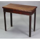 A late 18th century mahogany card table with rectangular fold-over top inset cloth surface, on