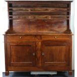 A 19th century French fruitwood dresser with two open shelves above two frieze drawers & a