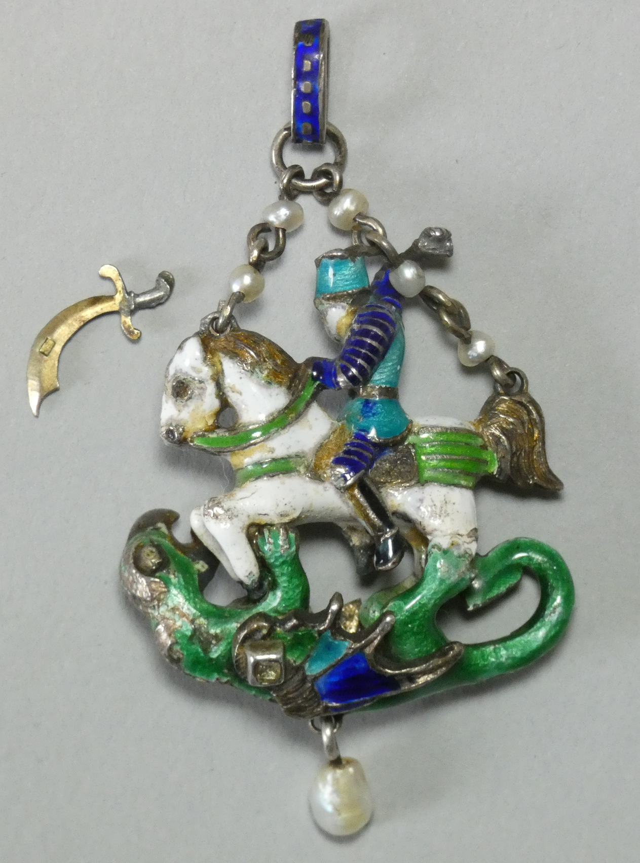 An Austro-Hungarian enamelled white metal pendant depicting St. George slaying the Dragon, - Image 2 of 3