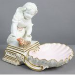 A 19th century Copeland porcelain ‘Seasons’ figure of a child kneeling before a fire, emblematic