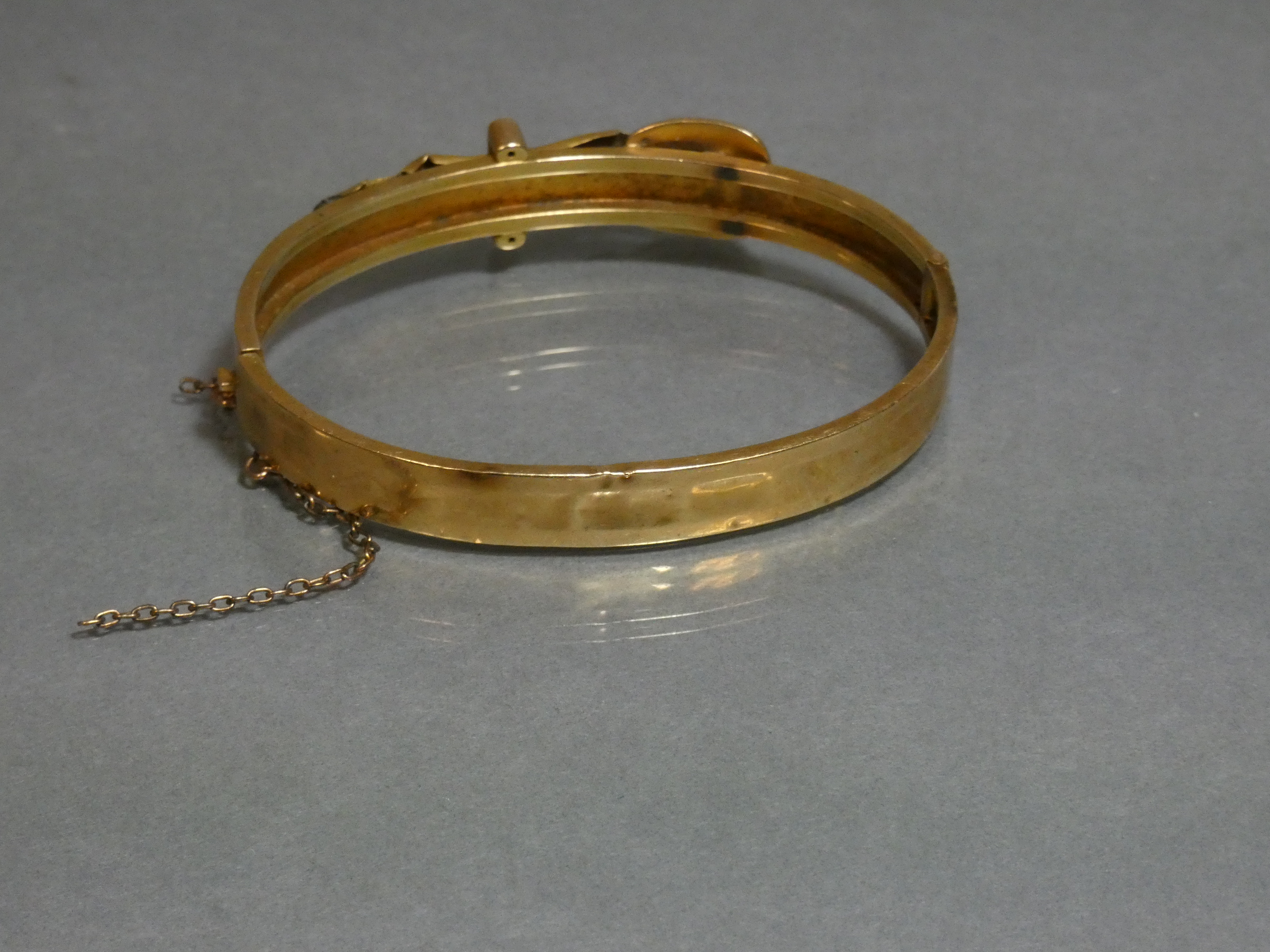 A yellow metal stiff hinged bangle of belt & buckle design, marked “14” (8.8g; w.a.f.) - Image 2 of 2